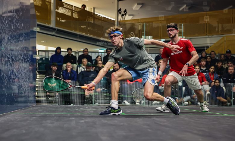 USA's Hollis Robertson (left) in action against Rowan Damming at the 2023 WSF World Junior Squash Championships.